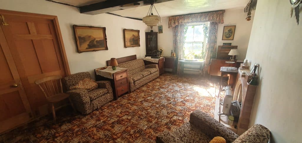 a living room filled with furniture and a fireplace