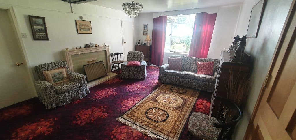 a living room filled with furniture and a rug