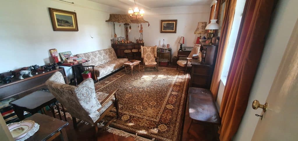 a living room filled with furniture and a fireplace