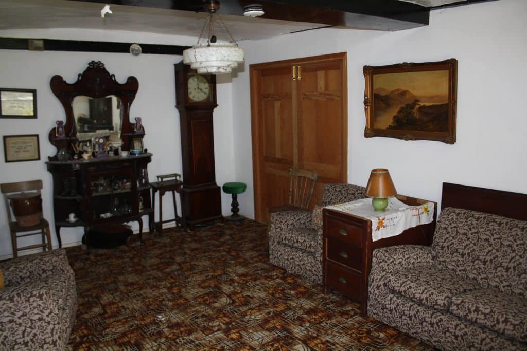 a living room filled with furniture and a rug
