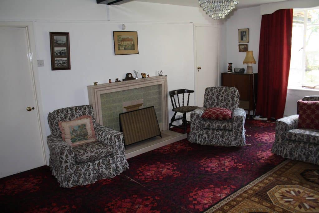 a living room filled with furniture and a rug