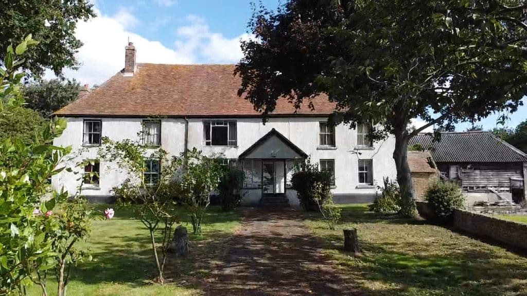 a house with trees in the background