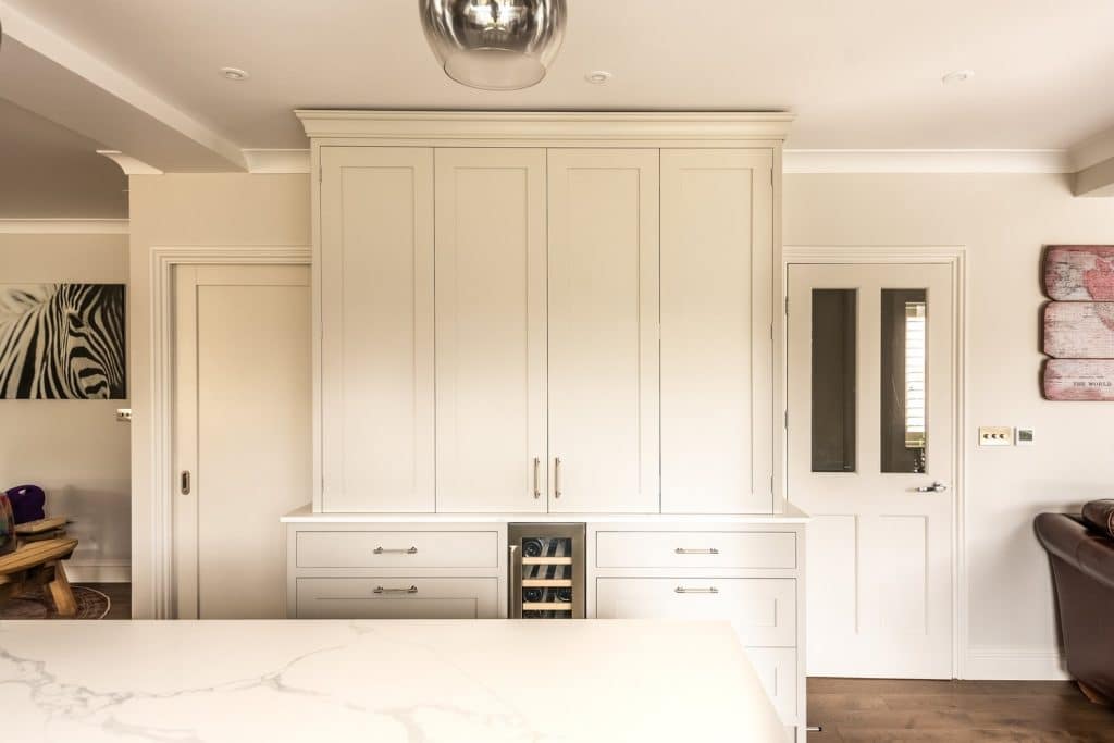 a kitchen with a large bed in a room
