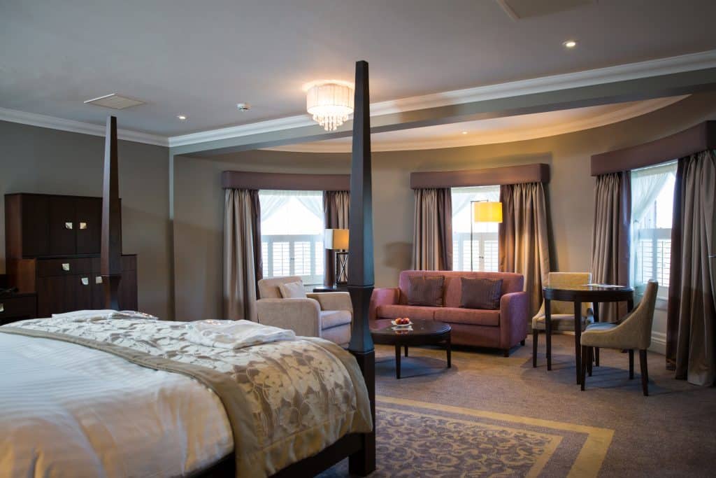 a bedroom with a large bed in a hotel room