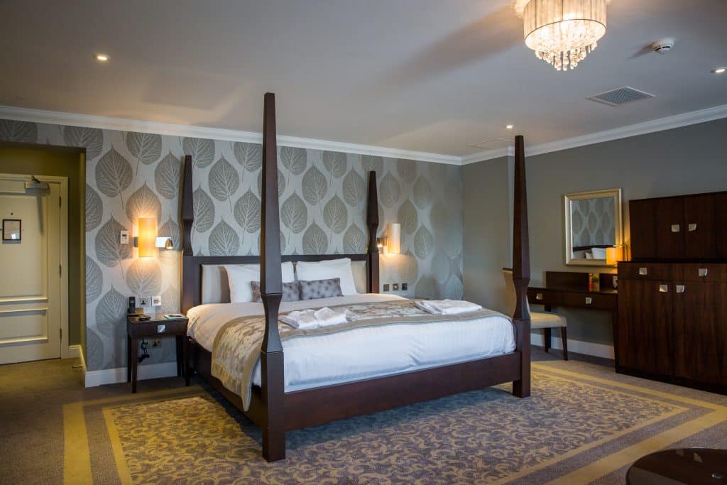 a bedroom with a large bed in a room