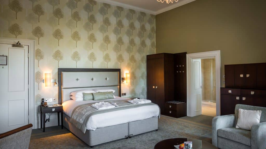 a bedroom with a large bed in a room
