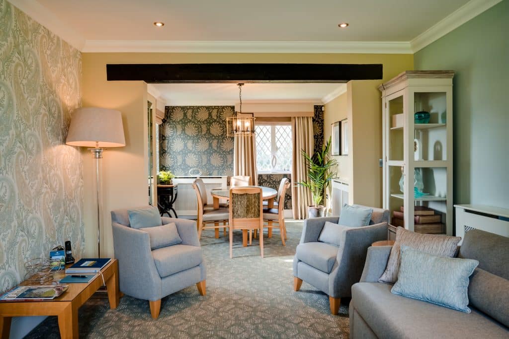 a living room filled with furniture and a fire place