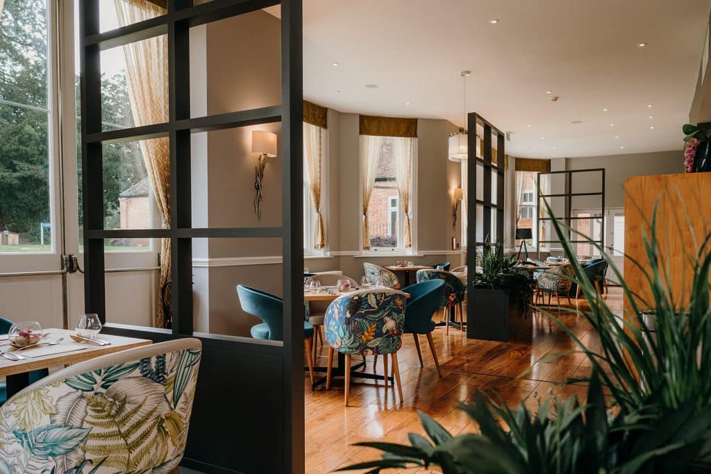 a living room filled with furniture and a large window