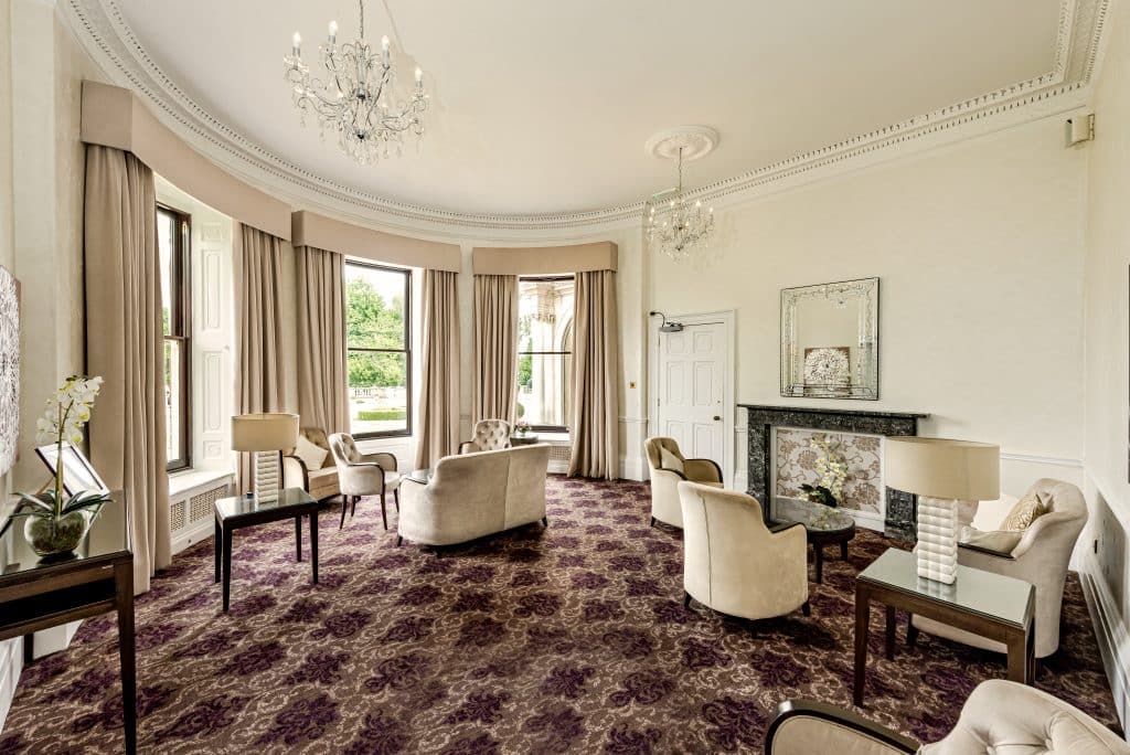 a living room filled with furniture and a large window