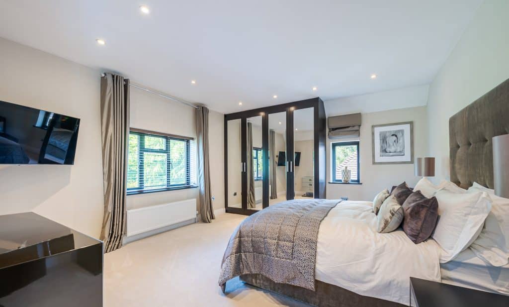 a bedroom with a large bed in a room