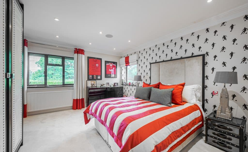 a bedroom with a large bed in a room