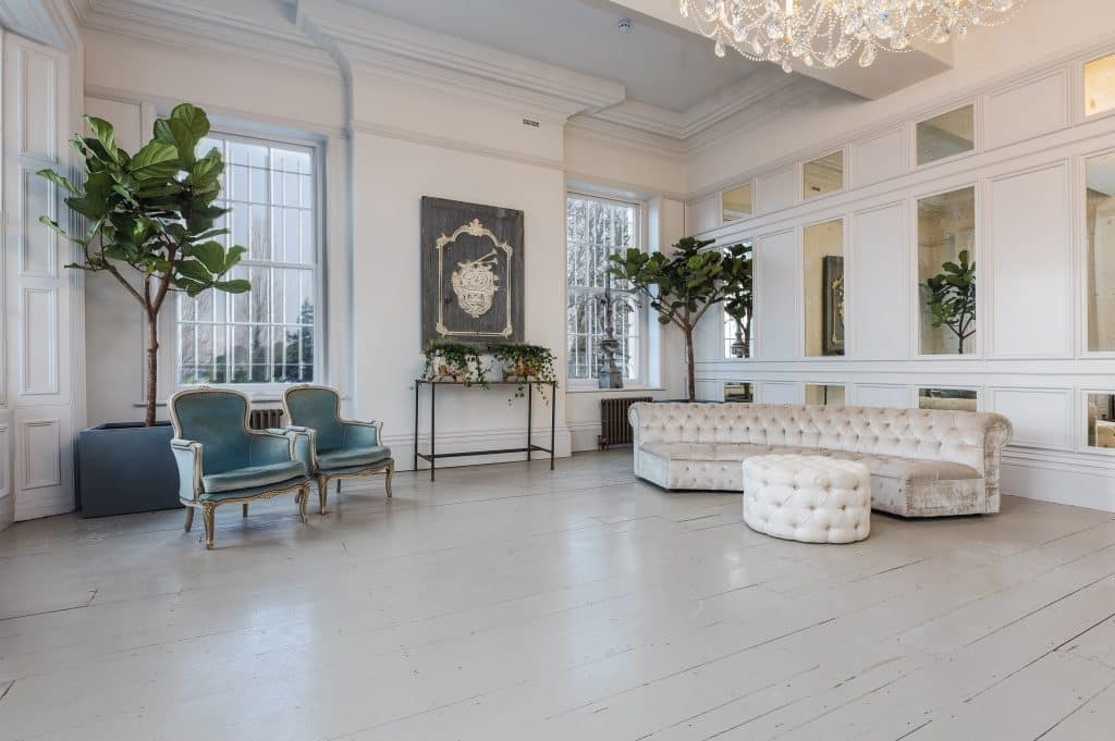 a living room filled with furniture and a large window