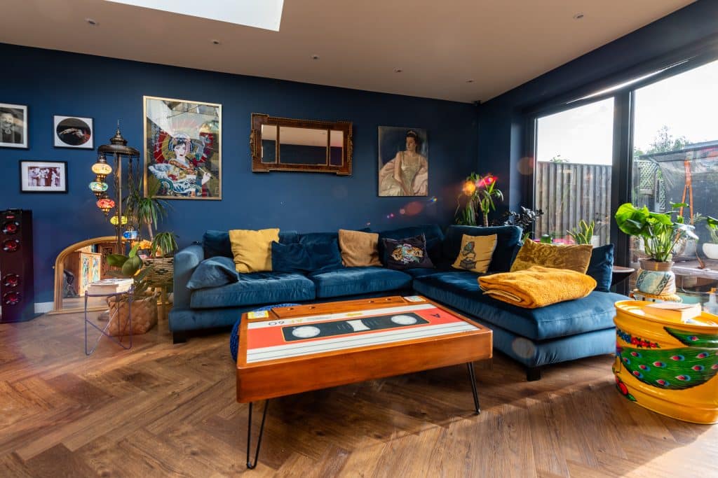 a living room filled with furniture and a large window