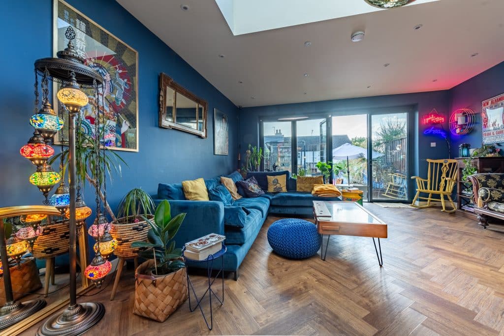a living room filled with furniture and a large window