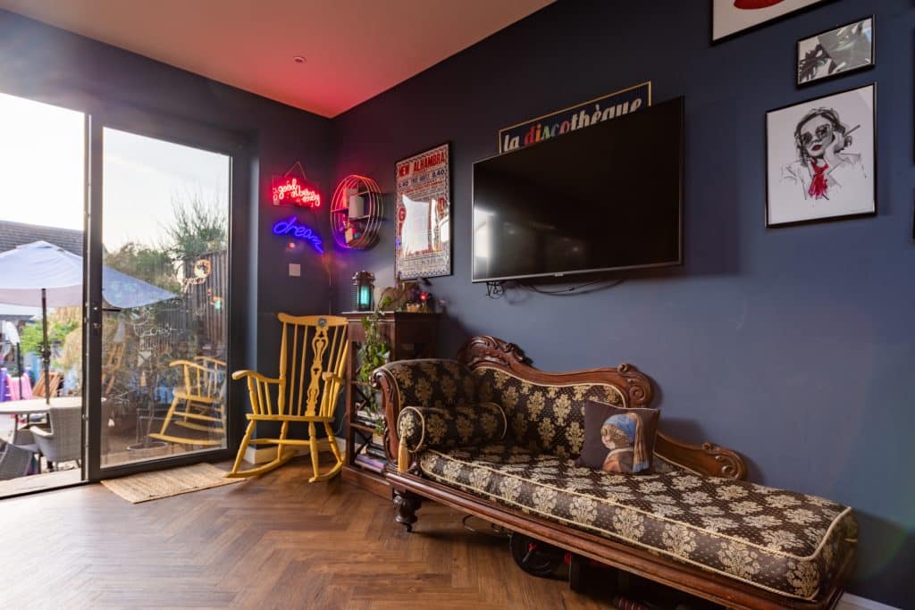 a living room filled with furniture and a large window