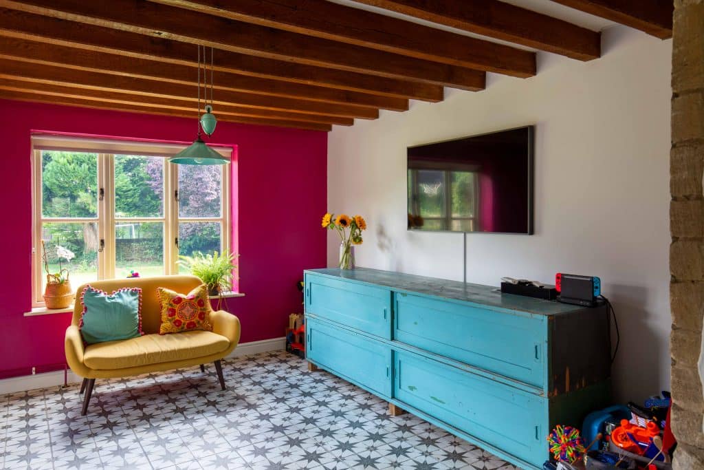 a living room filled with furniture and a large window