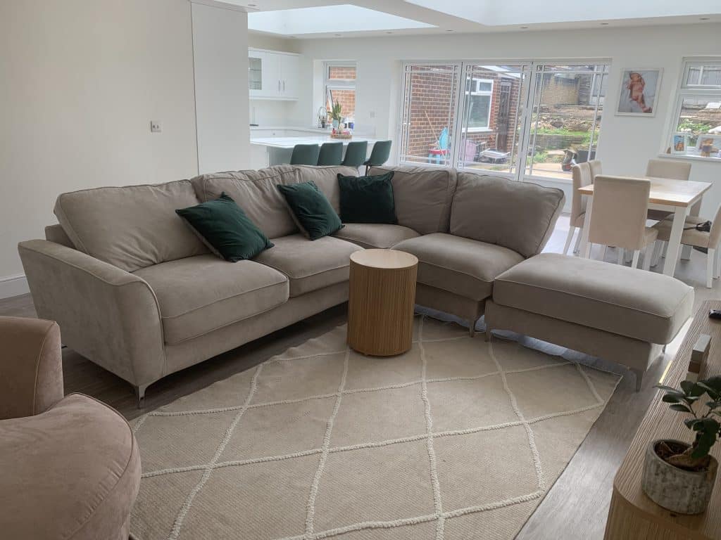 a living room filled with furniture and a large window