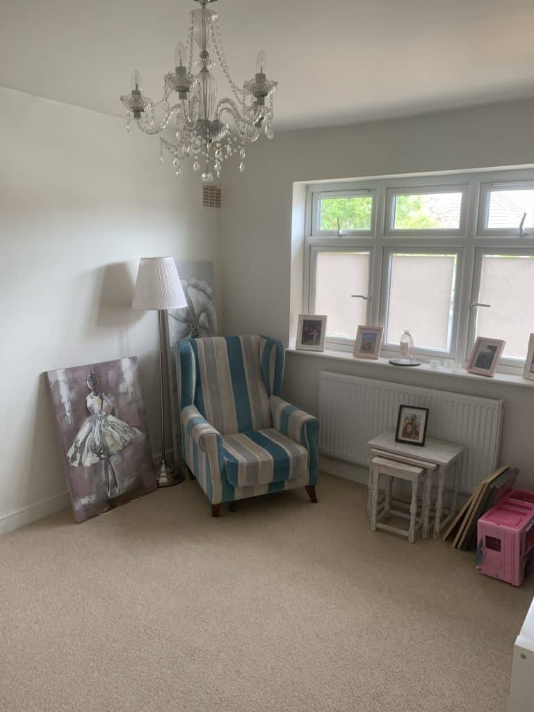 a bedroom with a large window