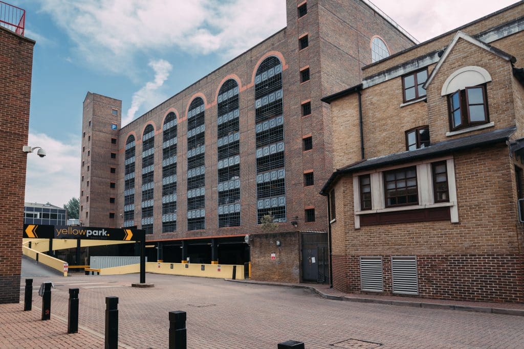 a city street in front of a brick building