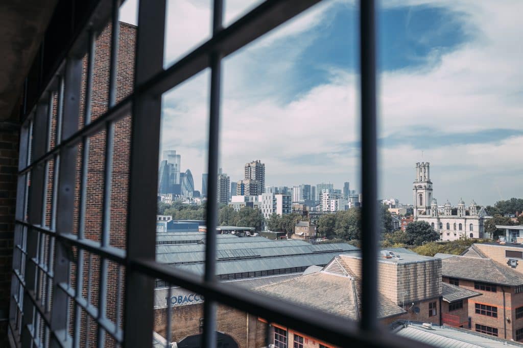 a view of a city next to a window