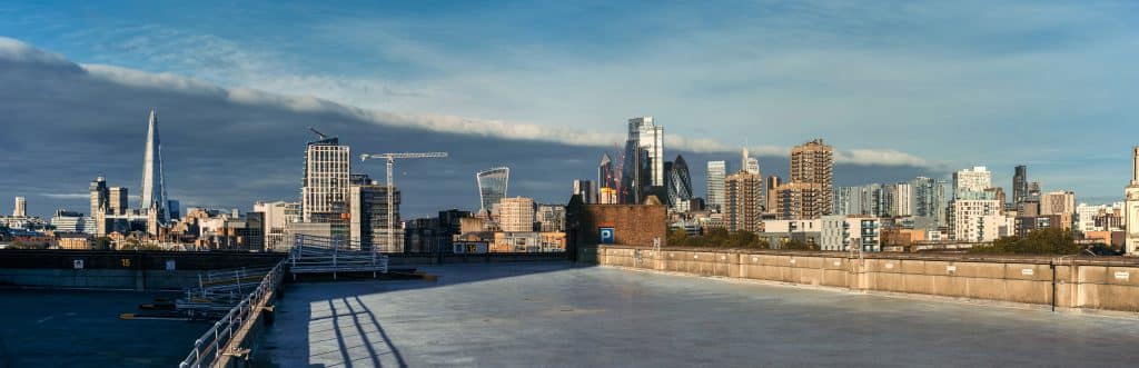a body of water with a city in the background