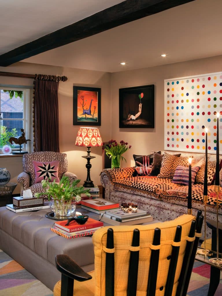 a living room filled with furniture and a large window
