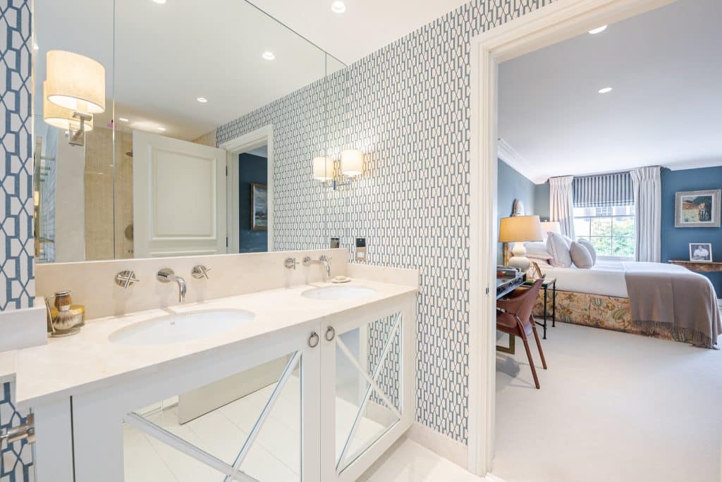 a room with a sink and a mirror