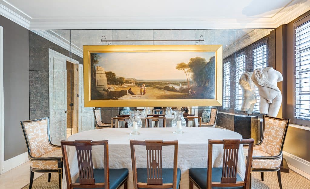 a dining room table in front of a window
