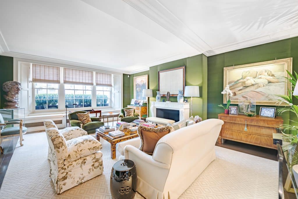 a living room filled with furniture and a large window