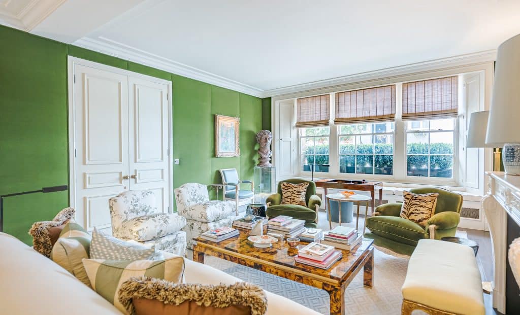 a living room filled with furniture and a large window