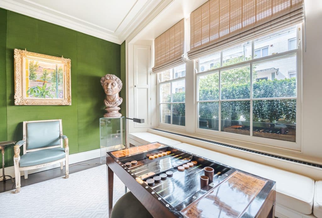 a room filled with furniture and a large window