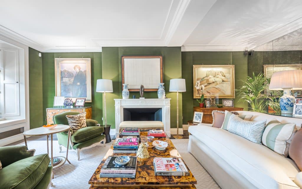 a living room filled with furniture and a fireplace