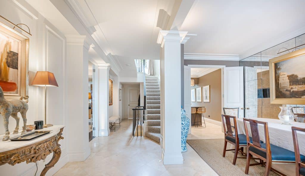 a living room filled with furniture and a large window