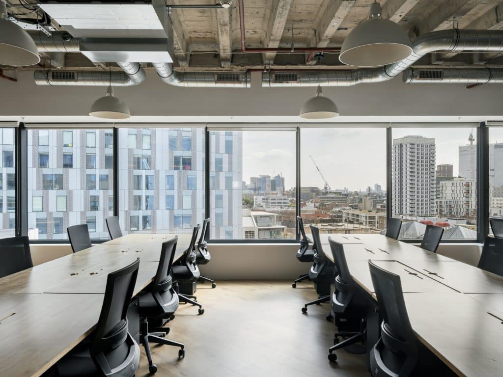a room filled with furniture and a large window