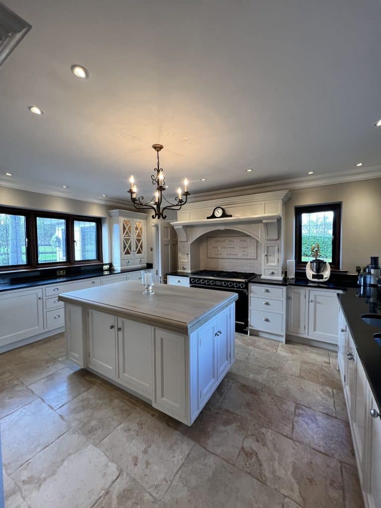 a large kitchen with an island in the middle of a room