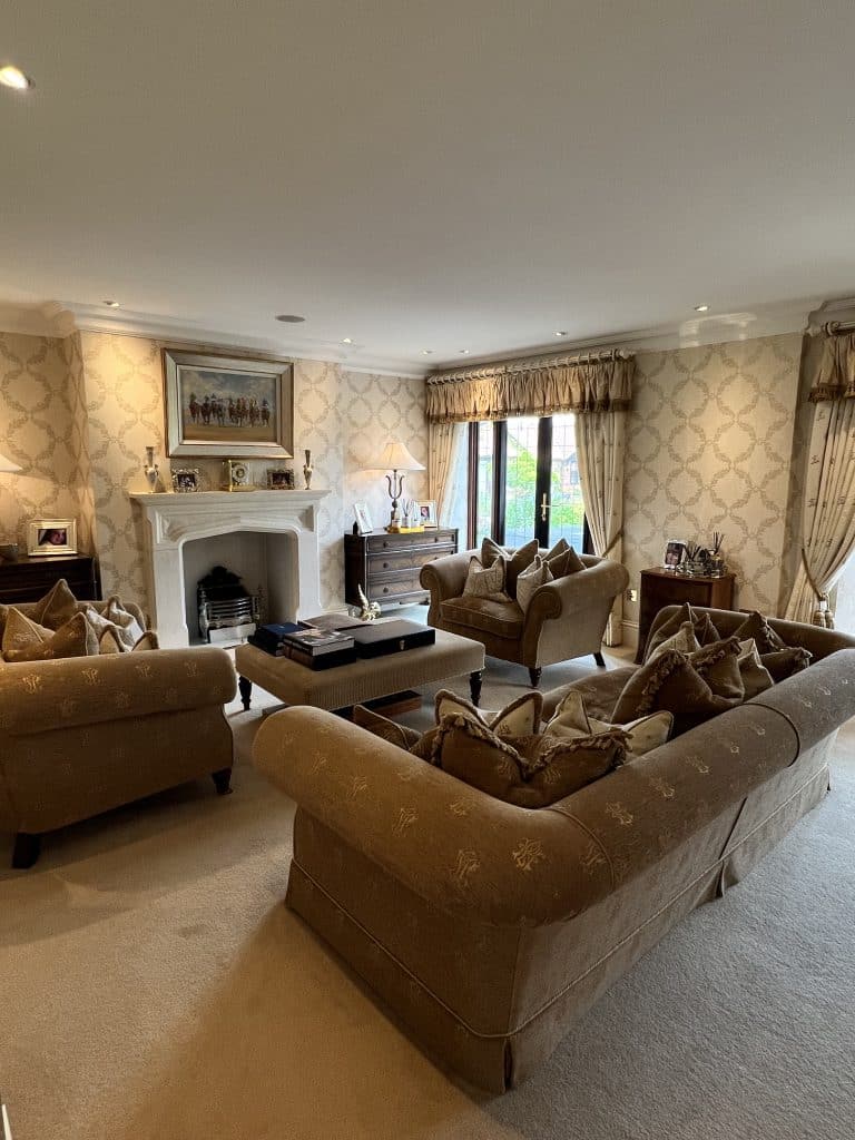 a living room filled with furniture and a large window
