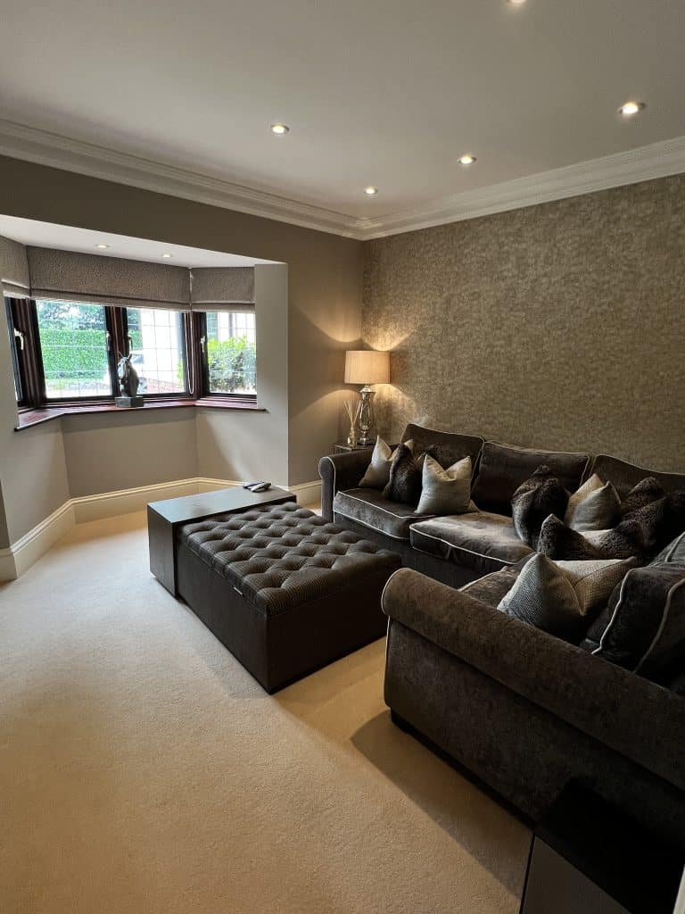 a living room filled with furniture and a flat screen tv