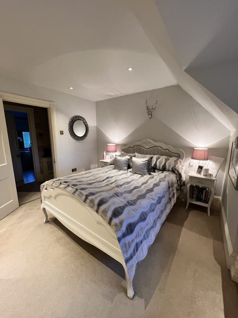 a bedroom with a bed in a room