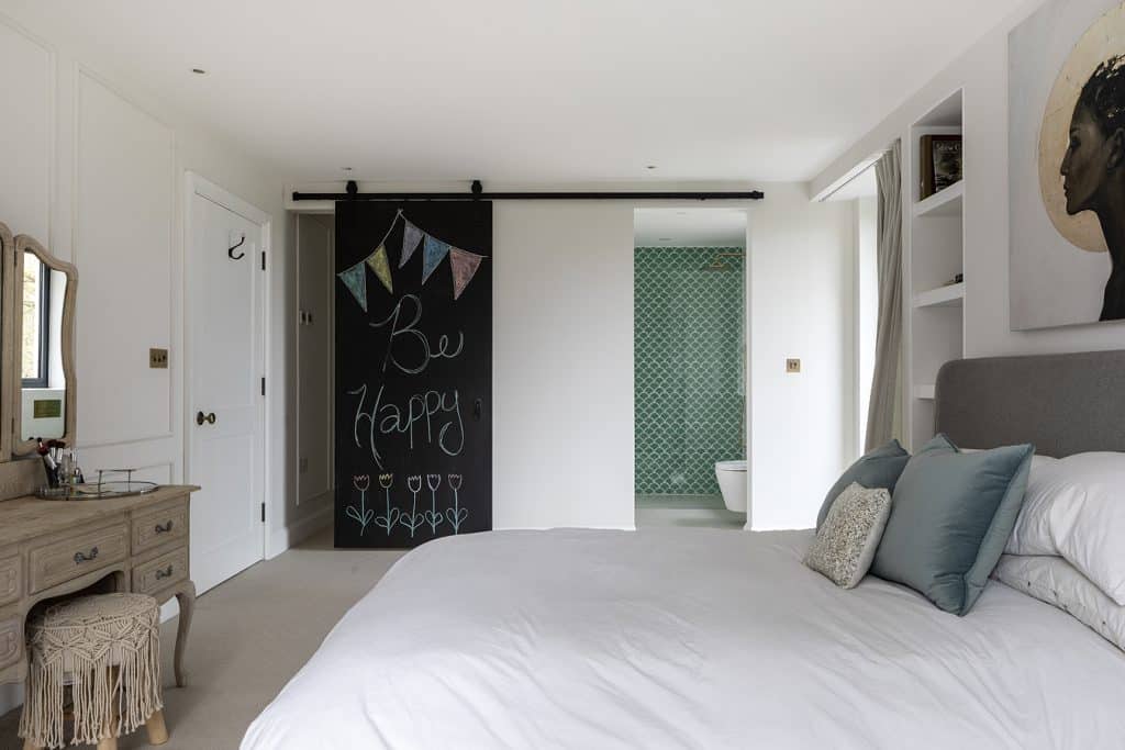 a bedroom with a large bed in a hotel room