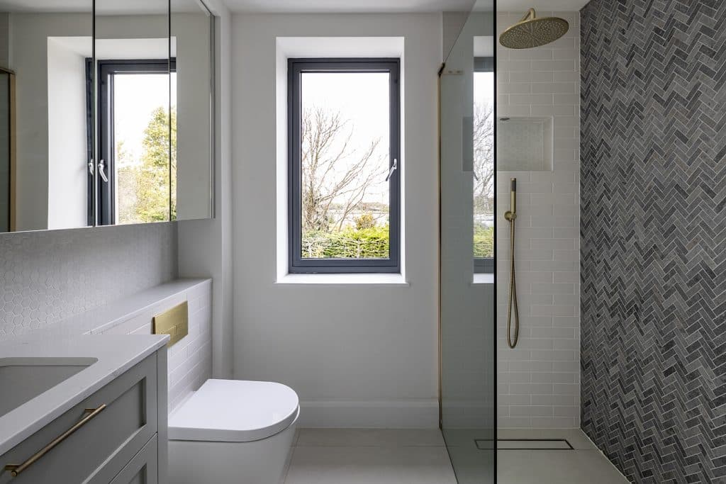 a room with a sink and a mirror