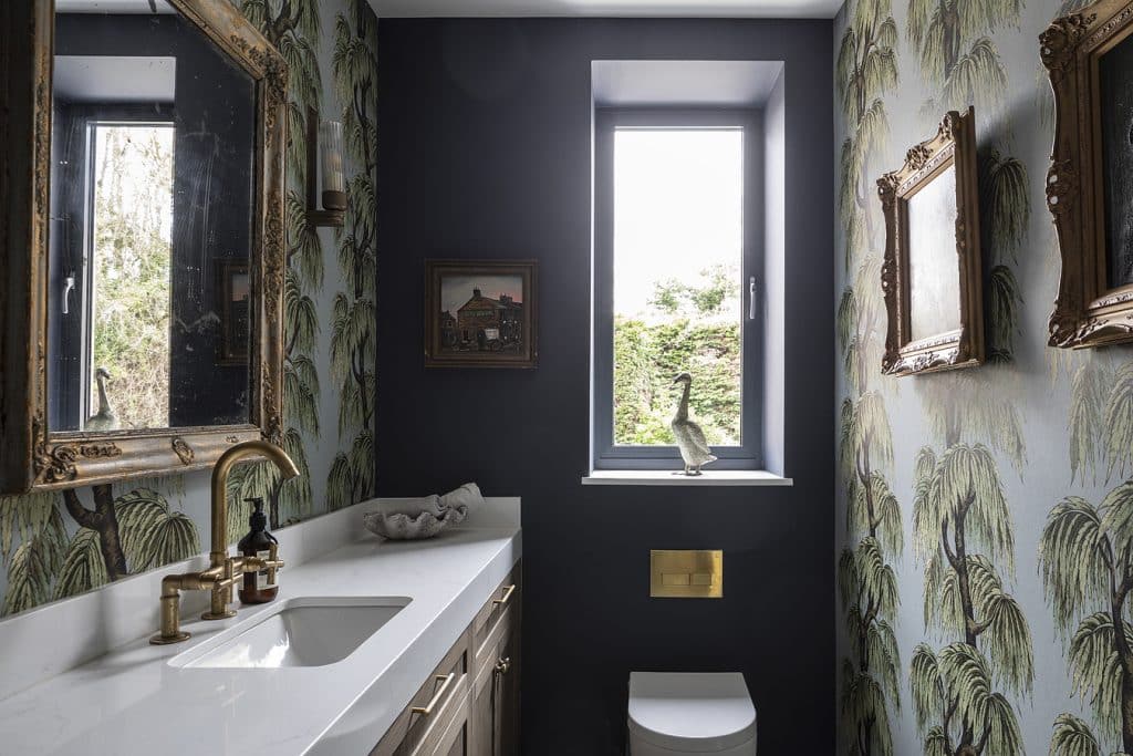 a room with a sink mirror and window