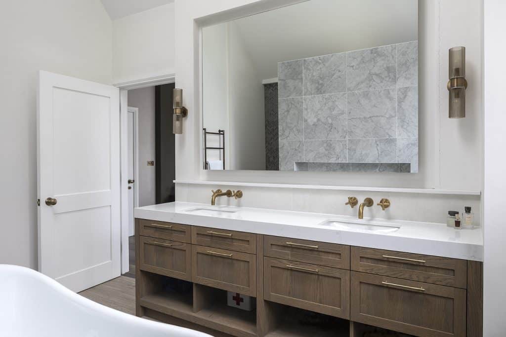 a room with a sink and a mirror