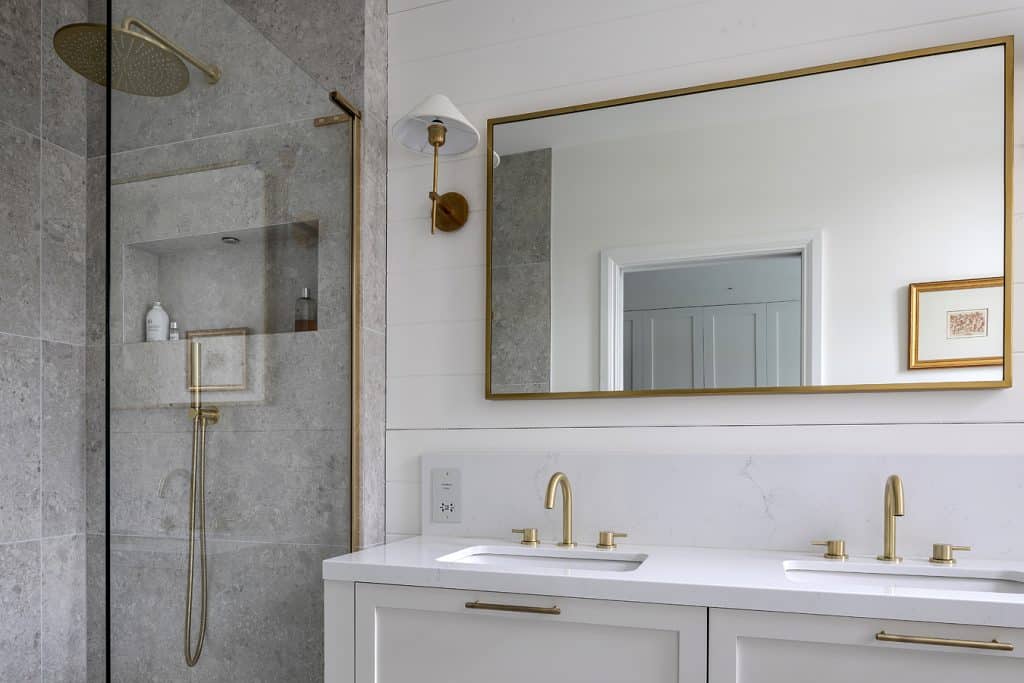 a kitchen with a sink and a mirror