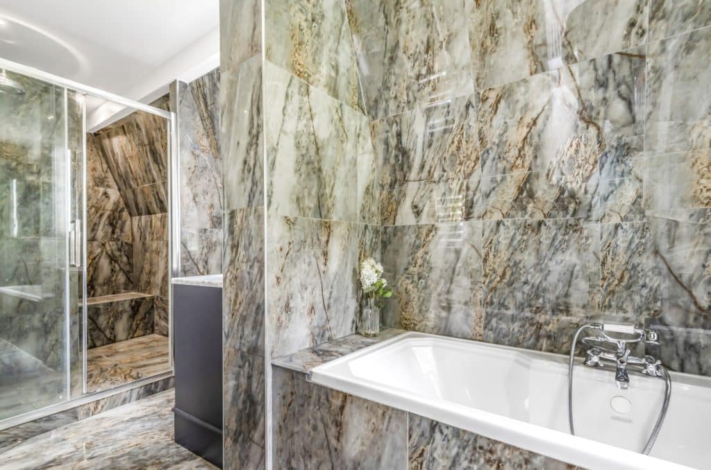 a large tub next to a sink