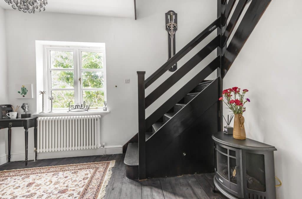 a living room filled with furniture and a fireplace