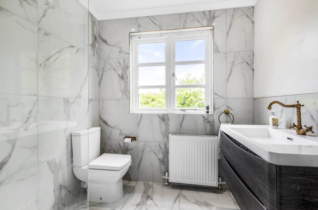 a room with a sink and a mirror
