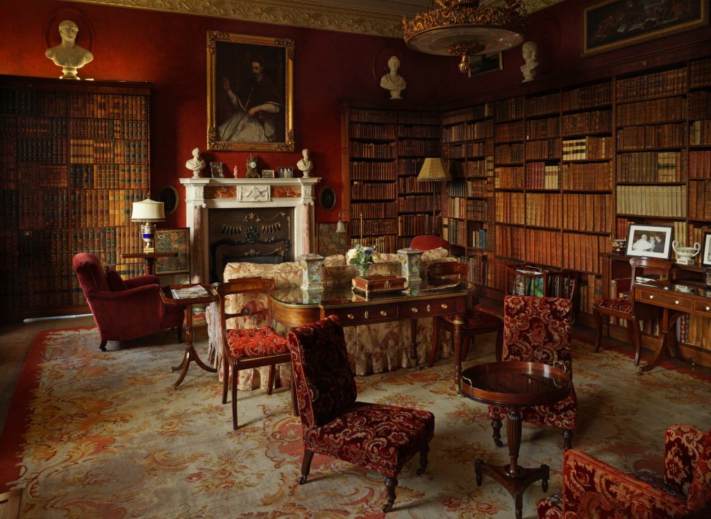 a living room filled with furniture and a fire place