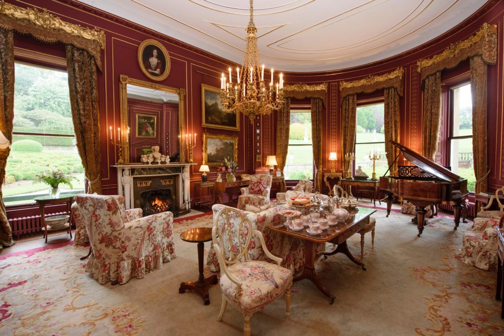 a living room filled with furniture and a fireplace