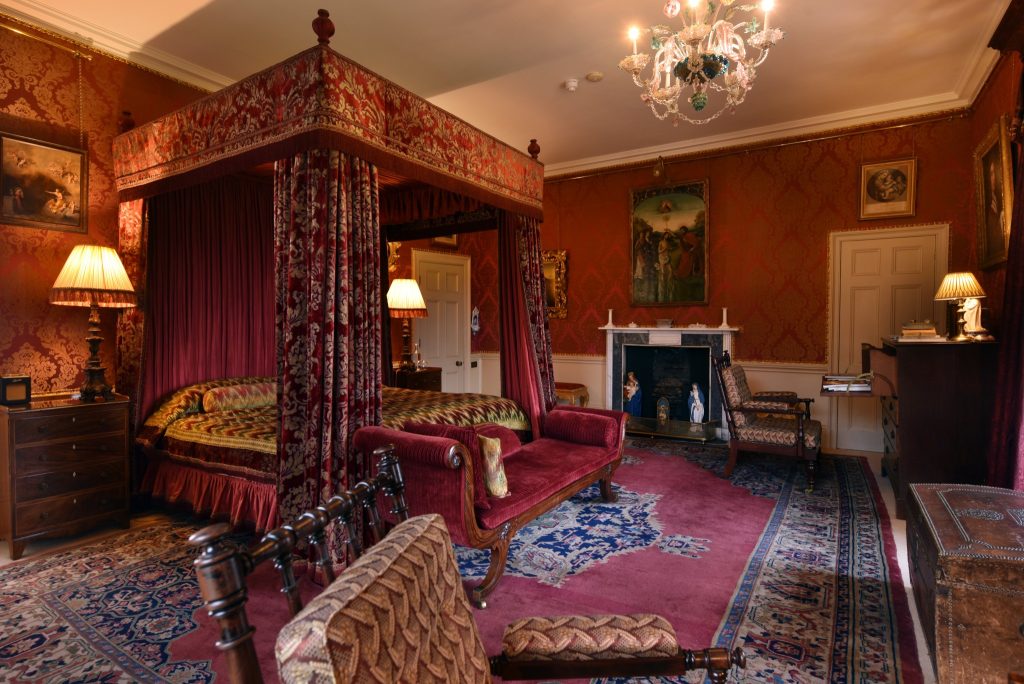 a living room filled with furniture and a fire place