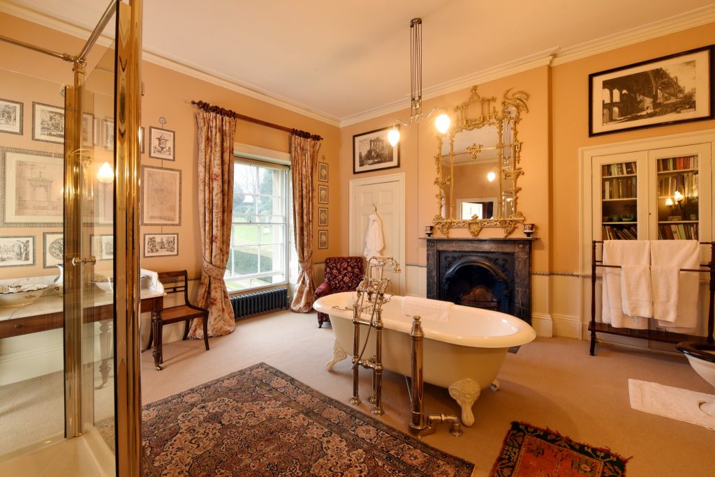 a living room filled with furniture and a large window